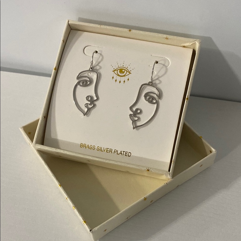 The luxe collection arm candy Silver Face Outline Earrings
